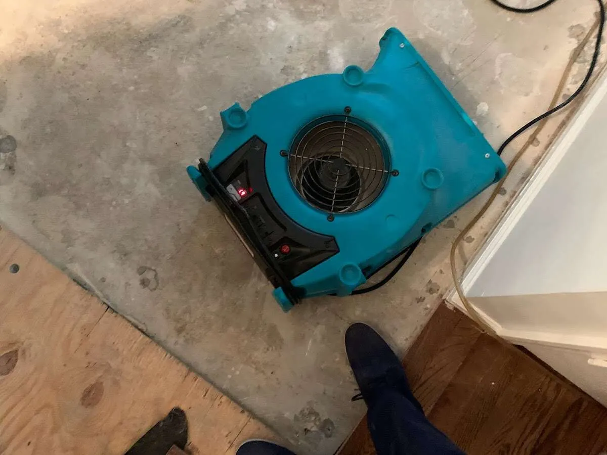 Air mover drying subfloor during Leak Detection & Repair in Star